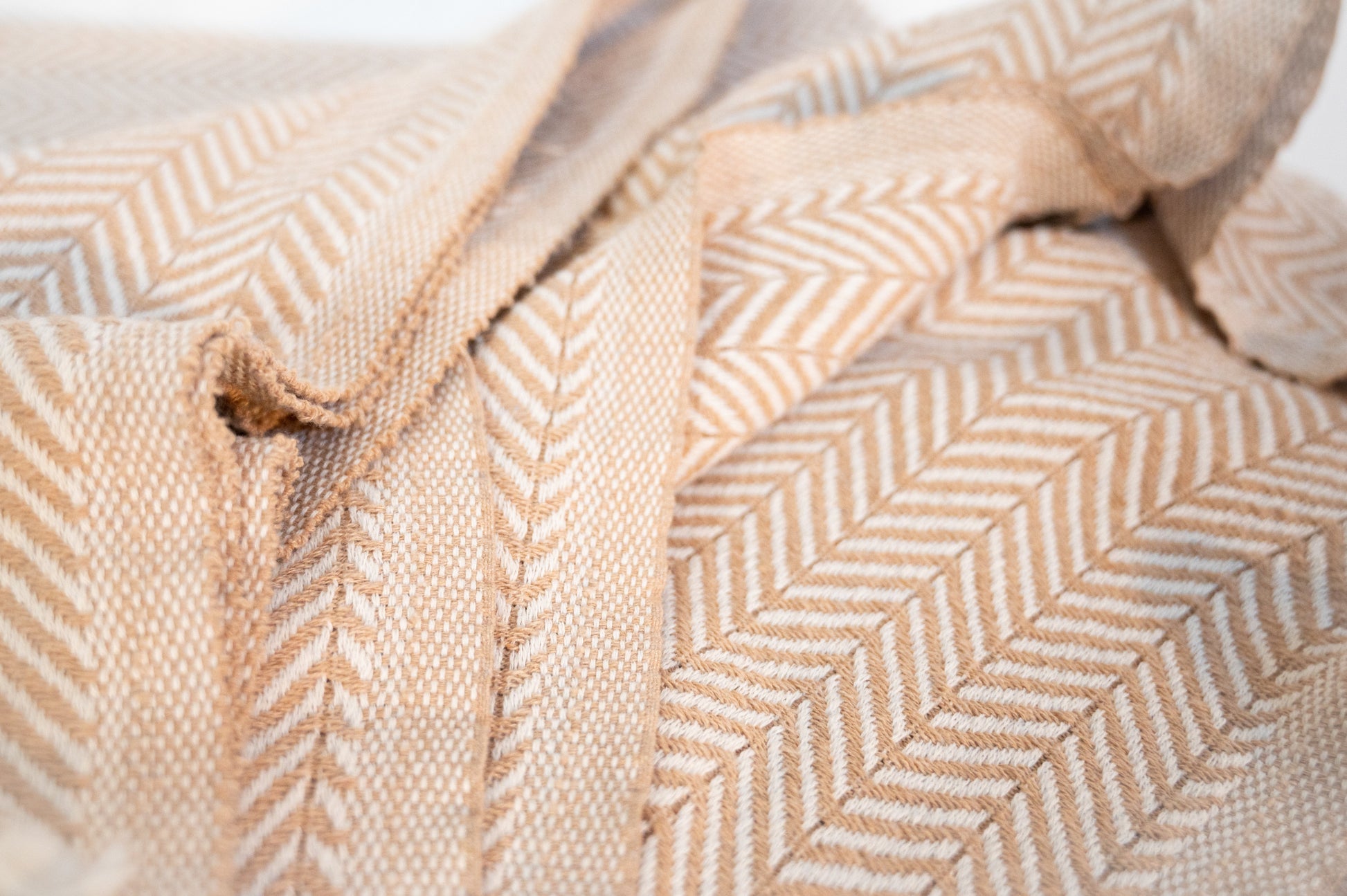 A close up shot showing the detailed stitching and herringbone weave.